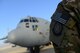 A U.S. Airman from the 41st Expeditionary Electronic Combat Squadron, stands next to an EC-130H Compass Call aircraft at Bagram Airfield, Afghanistan Sept. 12, 2014.  The 41 EECS provides premier counter-communications electronic attack capabilities.  The unit has flown 6,600 sorties and 38,000 hours in support of Operation Enduring Freedom. (U.S. Air Force photo by Staff Sgt. Evelyn Chavez/Released)
