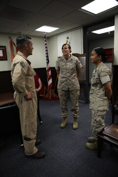 Maj. Gen. Michael Rocco, left, commanding general of 3rd Marine Aircraft Wing, speaks with Petty Officer 1st Class Barbara Mayer, center, a corpsman formerly with Marine Medium Tiltrotor Squadron (VMM) 364, and Petty Officer 2nd Class Samantha Sanchez, right, a corpsman with Marine Aviation Logistics Squadron (MALS) 11 aboard Marine Corps Air Station Miramar, Calif., March 31. Both Sailors recently received the senior and junior enlisted women of the year amongst 62 commands and 80 nominees from the San Diego area.  