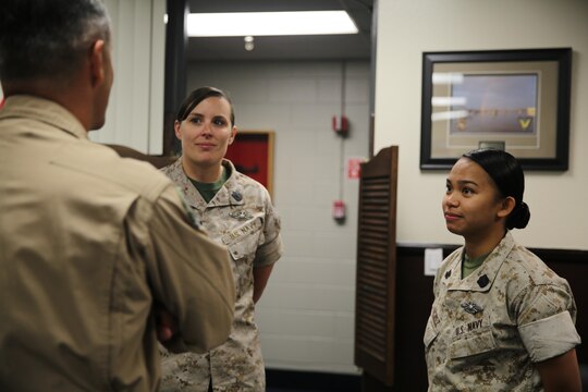 Maj. Gen. Michael Rocco, left, commanding general of 3rd Marine Aircraft Wing, speaks with Petty Officer 1st Class Barbara Mayer, center, a corpsman formerly with Marine Medium Tiltrotor Squadron (VMM) 364, and Petty Officer 2nd Class Samantha Sanchez, right, a corpsman with Marine Aviation Logistics Squadron (MALS) 11 aboard Marine Corps Air Station Miramar, Calif., March 31. Both Sailors recently received the senior and junior enlisted women of the year amongst 62 commands and 80 nominees from the San Diego area.  