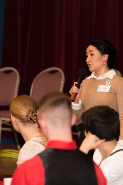Cpl. Guadalupe Campos, a broadcast journalist with the Armed Forces Network, speaks to attendees of the 2015 Women’s Leadership Symposium, March 31, inside the Club Iwakuni Ballroom aboard Marine Corps Air Station Iwakuni, Japan. In honor of Women’s History Month, the symposium was held to celebrate the resolve and drive of women in and out of the military.