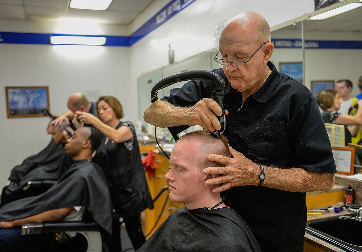 barber at the Basic Military Training Processing Center barbershop ...