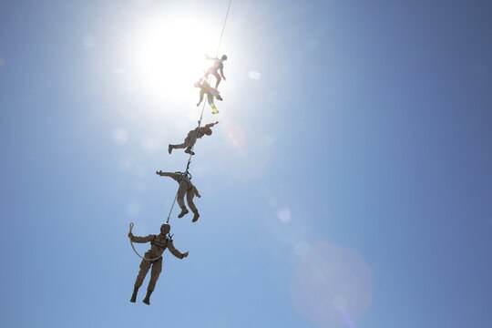 Reconnaissance Training Company Marines received an aerial view of Camp Pendleton during Special Patrol Insertion/Extraction training at San Mateo Landing Zone, April 17. The Marines, students of the Basic Reconnaissance Course, took turns being hoisted into the air by helicopter during the SPIE portion of their Helicopter Rope Suspension Training. During the course of HRST the students learn SPIE rigging, rappelling and fast rope techniques. 
