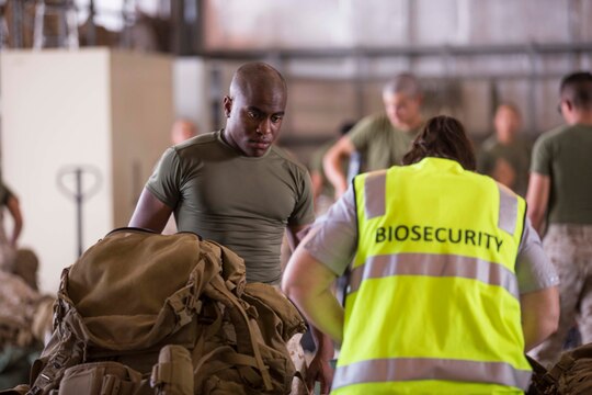 Lance Corporal John Porter has his gear inspected upon arrival April 14 to Royal Australian Air Force Base Darwin, Darwin, Australia, to begin Marine Rotational Force – Darwin 2015. Approximately 20 percent of Marines’ gear was inspected by the biosecurity officers with the Australian Department of Agriculture for any foreign soil, plants or seeds. MRF-D is the deployment of U.S. Marines to Darwin and the Northern Territory, for approximately six months at a time, where they will conduct exercises and training on a rotational basis with the Australian Defence Force. Porter, a Chicago, Illinois, native, is a rifleman with Company B, 1st Battalion, 4th Marine Regiment, Marine Rotational Force - Darwin.