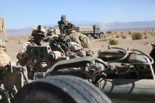 Corporal Osmar S. Gorish, a section chief for Battery A, 1st Battalion, 11th Marine Regiment, 1st Marine Division, supervises as his section adjusts the M777 155mm Howitzer’s azimuth during Exercise Desert Scimitar 2015 aboard Marine Corps Air Ground Combat Center Twentynine Palms, Calif., April 20, 2015. The tough, realistic live-fire training central to Desert Scimitar allows Division units to train in order to maintain readiness and meet current and real-world operational demands.