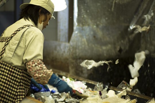 An employee at the Iwakuni City Recycling Plaza in Iwakuni City, Japan, sorts plastic to be recycled, April 24, 2015. The Facilities Environmental Branch Office aboard Marine Corps Air Station Iwakuni, Japan, provided station residents the opportunity to tour the Iwakuni City Recycling Plaza in celebration of Earth Day 2015.