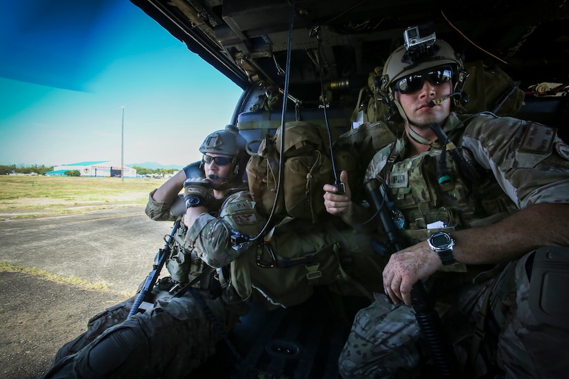 Air Force Staff Sgt. Dylan Crawford, left, and Staff Sgt. Jason Fischman, both pararescuemen with the 31st Rescue Squadron, prepare for takeoff from the former Clark Air Base, in the Philippines, April 23, 2015, as they respond to a notional mass casualty incident during Exercise Balikatan 2015. The drill was conducted alongside rescuemen from the 505th Rescue and Search Group of the Philippine Air Force. The bilateral training event provided both rescue teams with a better understanding of how each other operates and ensures mission accomplishment should they work side-by-side in the future. Balikatan is an annual Philippines-U.S. military training exercise and humanitarian assistance engagement, which highlights the long-standing partnership between both the nations. Marine Corps photo by Cpl. Rick Hurtado