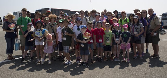 Scouts with Scout Troop 77 and residents from Marine Corps Air Station Iwakuni, Japan, gather together before exploring the 23rd World Scout Jamboree in Kirara-hama, Yamaguchi, Japan, August 1, 2015. This year’s jamboree included 34,000 scout participants from 150 countries. This was the first international event for local Scout Troop 77.