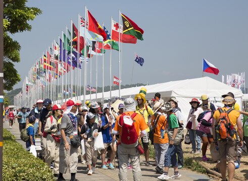 Scouts, residents from Marine Corps Air Station Iwakuni, Japan, and jamboree participants observe unique attractions from various countries at the 23rd World Scout Jamboree in Kirara-hama, Yamaguchi, Japan, August 1, 2015. Each country in attendance had a booth displaying traditional clothing and other cultural items, and scout paraphernalia.