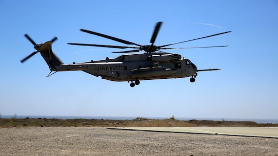 A CH-53E Super Stallion assigned to Marine Heavy Helicopter Squadron 361, 3rd Marine Aircraft Wing, prepares to land before transporting Marines with 3rd Battalion, 5th Marine Regiment, 1st Marine Division, as part of the Marine Corps Combat Readiness Evaluation (MCCRE), aboard Marine Corps Base Camp Pendleton, California, Aug. 4, 2015. The MCCRE is used evaluate the operational readiness of a designated unit. 