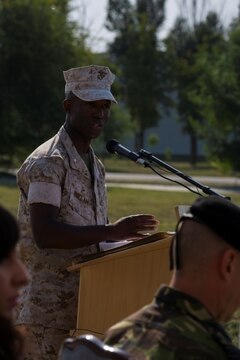 Lt. Col. Reginald McClam, oncoming commanding officer of Black Sea Rotational Force, gives his remarks during a transfer of authority ceremony aboard Mihail Kogalniceanu Air Base, Romania, July 6, 2015. During the ceremony, 3rd Bn., 8th Marines assumed authority of the Black Sea Rotational Force, a biannual rotation of Marines and Sailors that acts as a Security Cooperation Marine Air-Ground Task Force through conducting military-to-military engagements and enabling the continuation of regional stability, increasing interoperability, and building and maintaining relationships with allied and partner nations. (U.S. Marine Corps photo by LCpl. Melanye E. Martinez/Released)