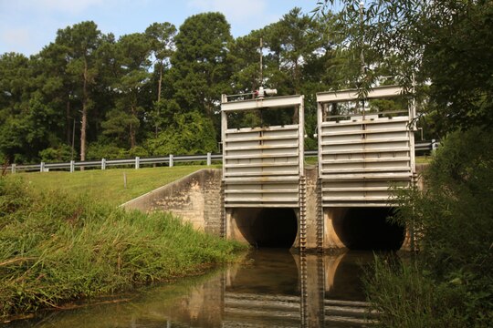 Spill gates stand ready to close at moment’s notice if a spill that could be detrimental to the environment occurs at Marine Corps Air Station Cherry Point, North Carolina, July 31, 2015. The gates provide a barrier to prevent contamination to receiving bodies of water.