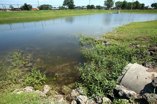 The Child Development Center stormwater control wet detention basins are a part of Stormwater Control Measures at Marine Corps Air Station Cherry Point, North Carolina, July 31, 2015. SCM’s are designed to remove pollutants from the water by treating, slowing, and reducing stormwater runoff while also preventing flooding from occurring in heavily developed areas. 