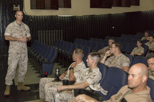 Lt. Col. James Moseley, a Command and Staff Blended Seminar Program instructor, briefs officers of Marine Corps Air Station Iwakuni, Japan, and Marine Aircraft Group 12 on the program at the Sakura Theater aboard station Aug. 5, 2015. BSP is part of the 36th Commandant’s Planning Guidance 2015 to expand resident professional military education.