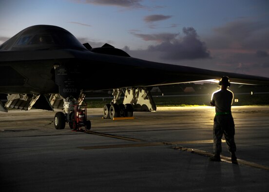 An aircraft maintainer with the 509th Aircraft Maintenance Squadron assists with the launch of a U.S. Air Force B-2 Spirit at Andersen Air Force Base, Guam, Aug. 12, 2015. Three B-2s and about 225 Airmen from Whiteman Air Force Base, Missouri, deployed to Guam to conduct familiarization training activities in the Indo-Asia-Pacific region. (U.S. Air Force photo by Senior Airman Joseph A. Pagán Jr./Released)