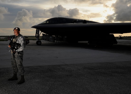 U.S. Air Force Senior Airman Jeico Sanchez-Arias, 509th Security Forces Squadron security journeyman, guards a U.S. Air Force B-2 Spirit on the flightline at Andersen Air Force Base, Guam, Aug. 12, 2015. Airmen and B-2 Spirits from the 13th Bomb Squadron at Whiteman Air Force Base, Missouri, are deployed to Guam to conduct familiarization training activities in the Pacific (U.S. Air Force photo by Senior Airman Joseph A. Pagán Jr./Released)