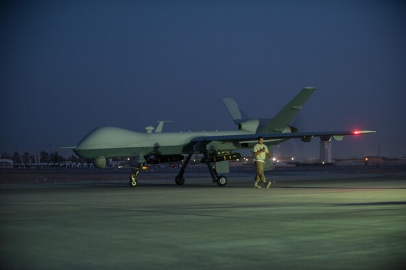 A U.S. Airman assigned to the 62nd Expeditionary Reconnaissance Squadron finishes a post flight inspection on a MQ-9 Reaper aircraft at Kandahar Airfield, Afghanistan, Aug. 13, 2015.  The 62nd ERS operates the MQ-1 Predator and Reaper aircraft and provides world-class close air support, intelligence, surveillance and reconnaissance capabilities in Afghanistan. (U.S. Air Force photo by Tech. Sgt. Joseph Swafford/Released) 