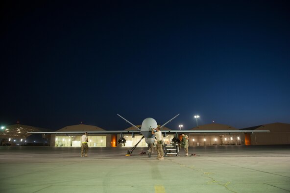 U.S. Airmen assigned to the 62nd Expeditionary Reconnaissance Squadron perform a post flight inspection on a MQ-9 Reaper aircraft at Kandahar Airfield, Afghanistan, Aug. 13, 2015.  The 62nd ERS operates the MQ-1B Predator and Reaper aircraft and provides world-class close air support, intelligence, surveillance and reconnaissance capabilities in Afghanistan. (U.S. Air Force photo by Tech. Sgt. Joseph Swafford/Released) 