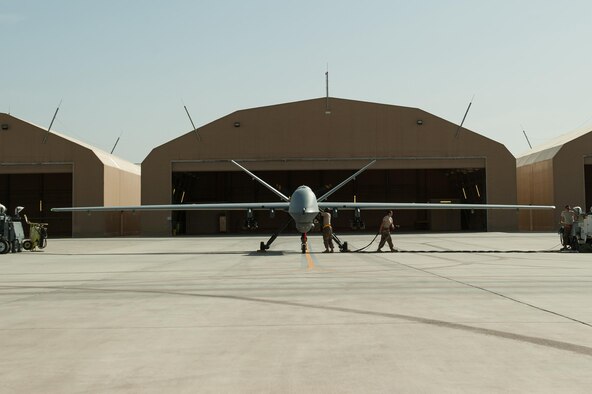 U.S. Airmen assigned to the 62nd Expeditionary Reconnaissance Squadron perform a preflight inspection on a MQ-9 Reaper aircraft at Kandahar Airfield, Afghanistan, Aug. 14, 2015.  The 62nd ERS operates the MQ-1B Predator and Reaper aircraft and provides world-class close air support, intelligence, surveillance and reconnaissance capabilities in Afghanistan. (U.S. Air Force photo by Tech. Sgt. Joseph Swafford/Released)   