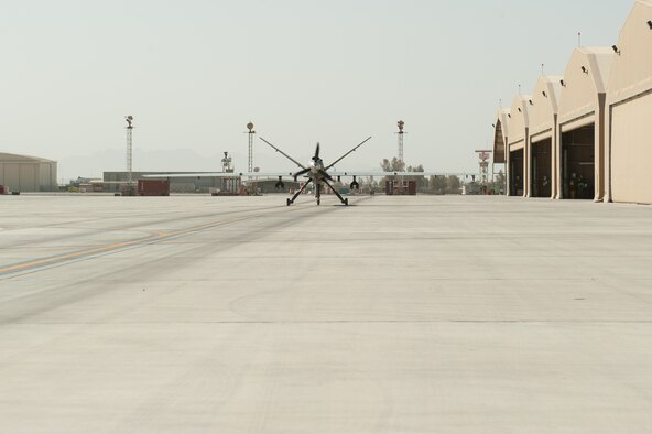 A U.S. Air Force MQ-9 Reaper aircraft assigned to the 62nd Expeditionary Reconnaissance Squadron taxis before taking off from Kandahar Airfield, Afghanistan, Aug. 13, 2015.  The 62nd ERS operates the MQ-1B Predator and Reaper aircraft and provides world-class close air support, intelligence, surveillance and reconnaissance capabilities in Afghanistan. (U.S. Air Force photo by Tech. Sgt. Joseph Swafford/Released)