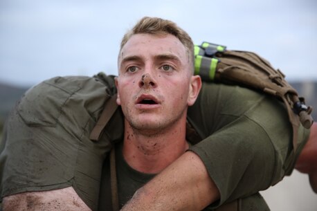 A Marine assigned to Company K, 3rd Battalion, 5th Marine Regiment, 1st Marine Division, conducts buddy squats as part of the Dark Horse Ajax Challenge aboard Marine Corps Base Camp Pendleton, Calif., Aug. 20, 2015. The eight-mile course tested the Marines’ and Sailors’ endurance and leadership skills with trials spread across the San Mateo area. (U.S. Marine Corps photo by Cpl. Will Perkins)