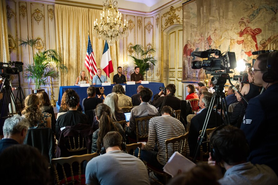 Airman 1st Class Spencer Stone along with Jane D. Hartley,  the U.S. ambassador to France, and his two friends speak at a press conference in Paris Aug. 23, 2015, following a foiled attack on a French train. Stone was on vacation with his childhood friends, Aleksander Skarlatos and Anthony Sadler, when an armed gunman entered their train carrying an assault rifle, a handgun and a box cutter. The three friends, with the help of a British passenger, subdued the gunman after his rifle jammed. Stone’s medical background prepared him to begin treating wounded passengers while waiting for the authorities to arrive. Stone is an ambulance service technician assigned to the 65th Medical Operations Squadron stationed at Lajes Field, Azores. (U.S. Air Force photo/Tech. Sgt. Ryan Crane)