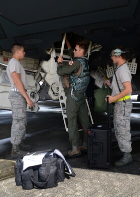 A U.S. Air Force B-2 Spirit pilot and maintainers from Whiteman Air Force Base, Missouri, load luggage onto the aircraft at Andersen Air Force Base, Guam, Aug. 17, 2015. Bomber deployments help maintain stability and security in the region, while allowing units to become familiar with operating in the Indo-Asia-Pacific region. (U.S. Air Force photo by Senior Airman Joseph A. Pagán Jr./Released)