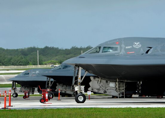 Three U.S. Air Force B-2 Spirits from Whiteman Air Force Base, Missouri, are parked on the flightline at Andersen Air Force Base, Guam, Aug. 17, 2015. Whiteman deployed approximately 225 Airmen and three aircraft here to conduct familiarization training in the Indo-Asia-Pacific region. (U.S. Air Force photo by Senior Airman Joseph A. Pagán Jr./Released)