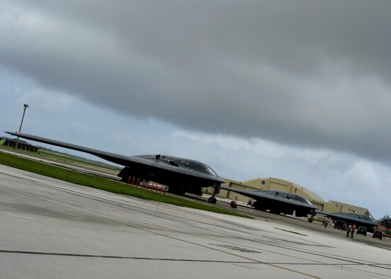 Three U.S. Air Force B-2 Spirits from Whiteman Air Force Base, Missouri, are parked on the flightline at Andersen Air Force Base, Guam, Aug. 17, 2015. Strategic bombers remain an effective means of providing extended deterrence against potential adversaries, while providing assurance to Allies. (U.S. Air Force photo by Senior Airman Joseph A. Pagán Jr./Released)