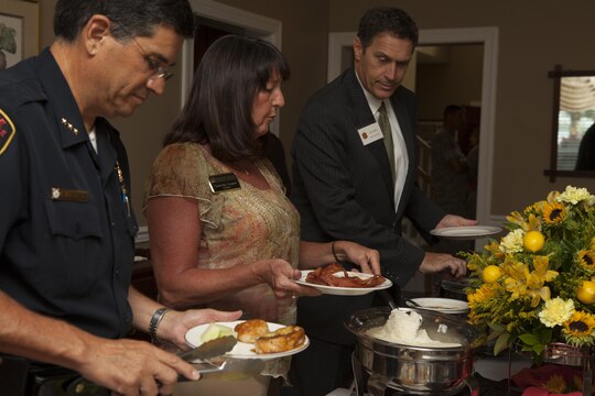 Guests of U.S. Marine Corps Maj. Gen. William D. Beydler, II Marine Expeditionary Force (II MEF) Commanding General, serve themselves food during a promotional breakfast for the Protect What You've Earned campaign on Camp Lejeune, N.C., Aug. 25, 2015. The campaign was created to encourage Marines to make the right decisions on and off duty. (U.S. Marine Corps photo by Lance Cpl. Sarah L. Blendowski, 2DMARDIV Combat Camera/Released)