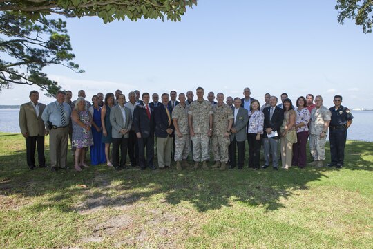 U.S. Marine Corps Maj. Gen. William D. Beydler, II Marine Expeditionary Force (II MEF) Commanding General, poses for a group photo to promote the Protect What You've Earned campaign on Camp Lejeune, N.C., Aug. 25, 2015. The campaign was created to encourage Marines to make the right decisions on and off duty. (U.S. Marine Corps photo by Lance Cpl. Sarah L. Blendowski, 2DMARDIV Combat Camera/Released)