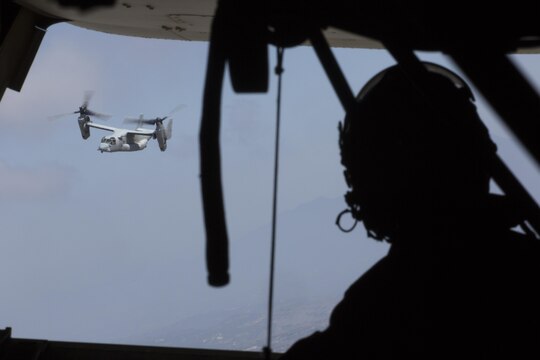 Two MV-22B Ospreys with Marine Medium Tiltrotor Squadron (VMM) 166 (Reinforced) prepare for a Tactical Recovery of Aircraft and Personnel mission aboard Marine Corps Base Camp Pendleton, California, Aug. 18. Marines conducted casualty evacuation drills as part of the 13th Marine Expeditionary Unit predeployment training. (U.S. Marine Corps photo by Sgt. Lillian Stephens/Released)
