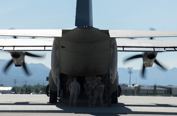 Paratroopers assigned to 1st Battalion (Airborne), 501st Infantry Regiment, 4th Infantry Brigade Combat Team (Airborne), 25th Infantry Division, U.S. Army Alaska board a C-130J Super Hercules, assigned to the Royal Australian Air Force No. 37 Squadron on Joint Base Elmendorf-Richardson, Alaska, Aug. 24, 2015. Japanese Ground Self-Defense Force and U.S. Army paratroopers conducted a parachute jump from Royal Australian and U.S. Air Force aircraft as part of Pacific Airlift Rally 2015, a biennial, multilateral tactical military symposium designed to enhance military airlift interoperability and cooperation between nations of the Pacific region for future humanitarian missions. (U.S. Air Force photo by Staff Sgt. Sheila deVera/Released)