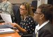 Jenna Lightfoot, 99th Air Base Wing community support coordinator, and Dr. Jacqueline Shiflet, Air Force Personnel Center chief of resilience operations, review Master Resilience Trainer Course information at the U.S. Air Force Expeditionary Center, Aug. 13. The MRTC, taught at the USAFEC, underwent an Instructional System Design review with credentialed Airmen whose professions align with the Comprehensive Airmen Fitness model of Mental, Physical, Social, and Spiritual domains. (U.S. Air Force photo/Bradley Camara)