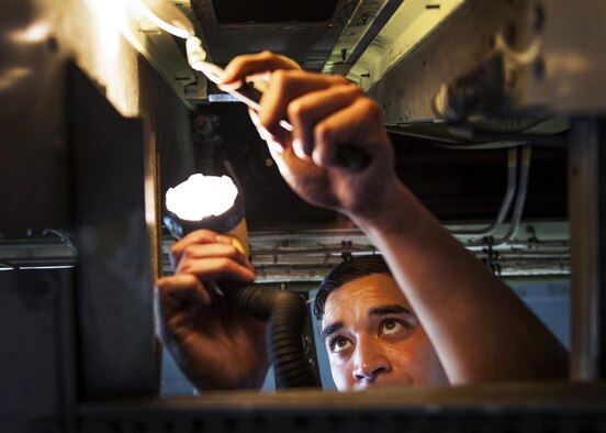Airman 1st Class William Hamal, a 19th Maintenance Squadron aircraft structural maintenance journeyman, replaces a forward main landing gear strut on a C-130J Super Hercules Nov. 19, 2015, at Little Rock Air Force Base, Ark. Aircraft structural maintenance personnel restore and maintain the structural integrity of aircraft. (U.S. Air Force photo/Senior Airman Stephanie Serrano)