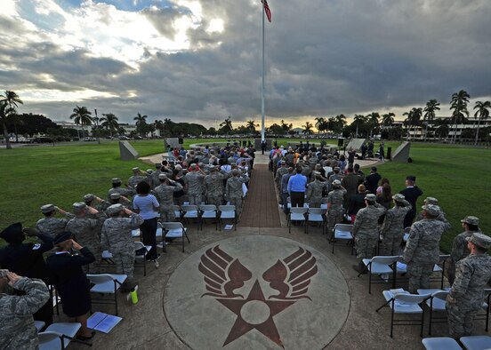 Military members salute during the singing of the national anthem at the Hickam Field Remembrance Ceremony hosted by the 15th Wing on Joint Base Pearl Harbor-Hickam, Hawaii, Dec. 7, 2015. Survivors and their family members attended the 74th remembrance ceremony, which honored the men and women who lost their lives on Hickam Field during the two waves of attacks launched by the Imperial Japanese Navy on Dec. 7, 1941. (U.S. Air Force photo/Tech. Sgt. Aaron Oelrich)
