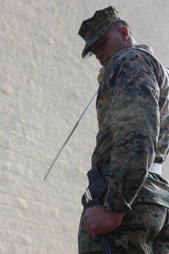 A corporal is tested on the execution of sword manual during Corporals Course 2-16 aboard Marine Corps Air Station Miramar, California, Dec. 7. Corporals Course, a professional military education program hosted by 3rd Marine Aircraft Wing, is a re-introduction of the basic Marine Corps values to noncommissioned officers. (U.S. Marine Corps Photo by Lance Cpl. Harley Robinson/Released)
