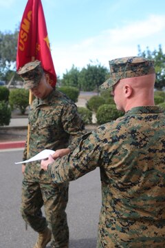 Sgt. Robert Hill, a faculty advisor instructor with 3rd Marine Air Wing’s Corporals Course, and a Williamsburg, Virginia native, grades a corporal on his execution of guidon manual aboard Marine Corps Air Station Miramar, California, Dec. 7. Corporals Course, a professional military education program hosted by 3rd Marine Aircraft Wing, is a re-introduction of the basic Marine Corps values to noncommissioned officers.(U.S. Marine Corps photo by Lance Cpl. Harley Robinson/Released)