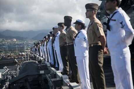 PEARL HARBOR, Hawaii (Dec. 3, 2015) U.S. Marines and man the rails while aboard the USS Essex (LHD-2) while pulling into port in Hawaii.  Hawaii is the 15th Marine Expeditionary Unit’s last port call before heading home after their WESTPAC 15 deployment. (U.S. Marine Corps photo by Sgt. Elize McKelvey/Released)