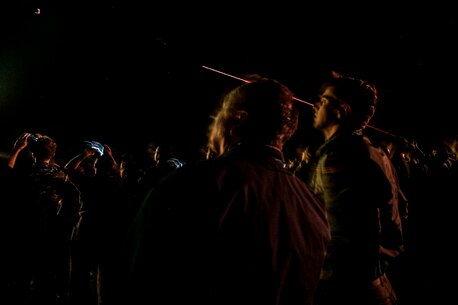 PACIFIC OCEAN (Dec. 9, 2015) - U.S. Marines with the 15th Marine Expeditionary Unit and Sailors with the Essex Amphibious Ready Group watch a 'fireworks' weapons display with the family members on the flight deck of amphibious assault ship USS Essex (LHD 2). The family members are on a Tiger Cruise from Hawaii back to California to experience the day-to-day life of their Marines and Sailors. (U.S. Marine Corps photo by Sgt. Elize McKelvey/Released)
