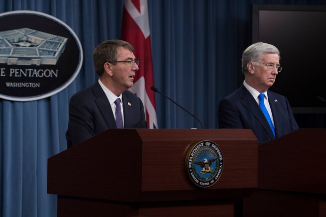 U.S. Defense Secretary Ash Carter and British Defense Secretary Michael Fallon conduct a joint news conference at the Pentagon Dec. 11, 2015, after meeting to discuss matters of mutual interest. Carter hosted an enhanced honor cordon to welcome Fallon to the Pentagon. DoD photo by Air Force Senior Master Sgt. Adrian Cadiz