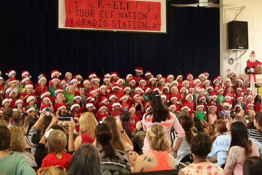 MARINE CORPS BASE HAWAII - Students from Mokapu Elementary School aboard Marine Corps Base Hawaii performed at their schools auditorium Dec. 17, 2105. The students celebrated the Christmas season with a concert, “K-ELF, YOUR ELF NATION, RADIO STATION,” to showcase what they have learned, and have been practicing for the Christmas concert in music class since August. (U.S. Marine Corps Photo by Lance Cpl. Jesus Sepulveda Torres)