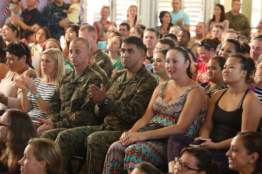 MARINE CORPS BASE HAWAII - Parents and family applaud for students at Mokapu Elementary School aboard Marine Corps Base Hawaii, Dec. 17, 2015. They watched as students sang Christmas songs and danced to music. The students celebrated the Christmas season with a concert to showcase what they have learned, and have been practicing for the Christmas concert since August. Every grade participated and dressed up for the concert. (U.S. Marine Corps Photo by Lance Cpl. Jesus Sepulveda Torres)