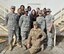 Residents of Bay A, Dorm 200 pose for a group photo outside their dormitory at an undisclosed location in Southwest Asia, Dec. 20, 2015.  The residents, 380th Air Expeditionary Security Forces Squadron Airmen, recently completed a month-long dorm renovation project to make their living areas more home-like. (U.S. Air Force photo by Staff Sgt. Kentavist P. Brackin/released)