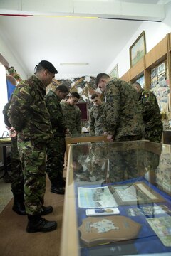 Romanian Marines take the U.S. Marines through their museum which held several historic artifacts for the Romanians, Jan. 29, in Babadag, Romania. This museum held artifacts from World War I to current exercises that the unit has participated in. This was at the end of a three-day workshop that the U.S. Marines held with the only Romanian Marine battalion about tactics and troop leading procedures and how the U.S. Marines utilize there noncommissioned officers. 