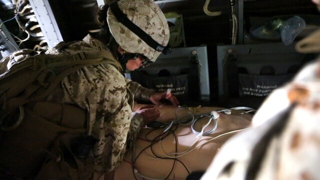 A corpsman with Alpha Surgical Company, 1st Medical Battalion, 1st Marine Logistics Group, treats a simulated casualty during an en-route care exercise aboard Camp Pendleton, Calif., Jan. 28, 2015. During the four-day exercise, corpsmen trained to prepare a Special-Purpose Marine Air-Ground Task Force group that is going to forward deploy later this year. The more than 40 corpsmen set up a shock trauma platoon facility, or mobile emergency room, to treat simulated casualties. The casualties were stabilized in the STP and then flown out via aircraft. (U.S. Marine Corps photo by Sgt. Laura Gauna/Released)