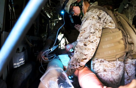 A corpsman with Alpha Surgical Company, 1st Medical Battalion, 1st Marine Logistics Group, treats a simulated casualty during an en-route care exercise aboard Camp Pendleton, Calif., Jan. 28, 2015. During the four-day exercise, corpsmen trained to prepare a Special-Purpose Marine Air-Ground Task Force group that is going to forward deploy later this year. The more than 40 corpsmen set up a shock trauma platoon facility, or mobile emergency room, to treat simulated casualties. The casualties were stabilized in the STP and then flown out via aircraft. (U.S. Marine Corps photo by Sgt. Laura Gauna/Released)