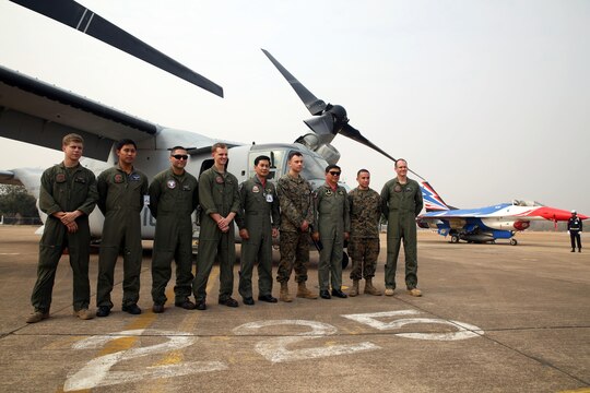 Air Vice-Marshal Bhanupong Seyayongka, third from the right, stands with Royal Thai Air Force personnel and U.S. Marines from Marine Medium Tiltrotor Squadron 262, Marine Aircraft Group 36, I Marine Aircraft Wing, III Marine Expeditionary Force for a picture in front of a U.S. Marine MV-22 Osprey and a RTAF F-16 Air Defense Fighter at an open house held by Royal Thai Air Force Wing 1 and U.S. Marines at Royal Thai Air Force Base Korat during Exercise Cobra Gold 2015, Feb. 13. Cobra Gold is a Thailand /United States co-sponsored, multinational and joint theater security cooperation exercise, conducted annually in the Kingdom of Thailand, with 25 nations participating. This year there is an increased focus on Humanitarian Civic Action, community engagement, and medical activities to support the needs and humanitarian interests of civilian populations around the region. For more information on exercise Cobra Gold, please visit the official Facebook page at http://www.facebook.com/ExerciseCobraGold.