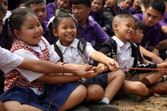 Students from Yothinnukun School learn how to manipulate objects safely from a distance using a rope during an Explosive Ordnance Disposal demonstration on Friendship Day, held by Royal Thai Air Force Wing 1 and U.S. Marines at Royal Thai Air Force Base Korat during Exercise Cobra Gold 2015, Feb. 13. Students observed demonstrations of the Marine Corps Martial Arts Program, Explosive Ordnance Disposal, Aircraft Rescue Firefighting, and Navy Corpsmen basic medical procedures. Cobra Gold 2015 is a Thailand /United States co-sponsored, multinational and joint theater security cooperation exercise, conducted annually in the Kingdom of Thailand, with 25 nations participating. This year there is an increased focus on Humanitarian Civic Action, community engagement, and medical activities to support the needs and humanitarian interests of civilian populations around the region. For more information on exercise Cobra Gold, please visit the official Facebook page at http://www.facebook.com/ExerciseCobraGold.