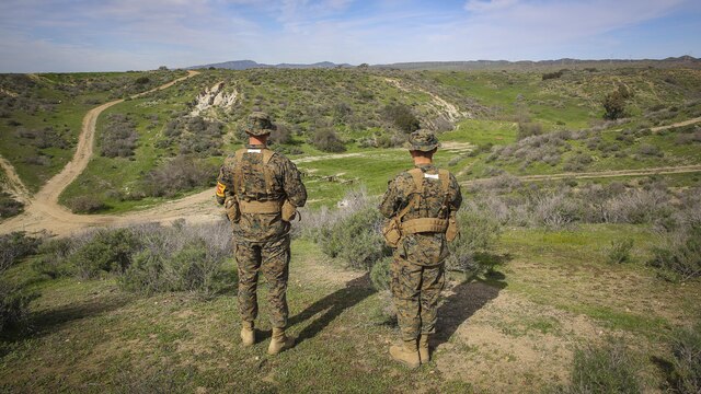 Recruits Jacob R. Kottman and Chainey L. Ellis, (left to right) Platoon 2105, Echo Company, 2nd Recruit Training Battalion, determine the direction to their mark during the Land Navigation Course at Edson Range, Marine Corps Base Camp Pendleton, Calif., Jan. 22.  Going through the course with minimal, or at times no supervision, recruits had a chance to get a sense of the critical factor of learning and properly executing the techniques they were taught.