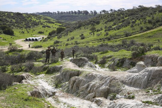 Recruits of Echo Company, 2nd Recruit Training Battalion, make their way through the Land Navigation Course at Edson Range, Marine Corps Base Camp Pendleton, Calif., Jan. 22.  After determining their pace count, recruits were paired up, given a set of coordinates that identified where their ammunition cans were located and sent out into the course to find them.